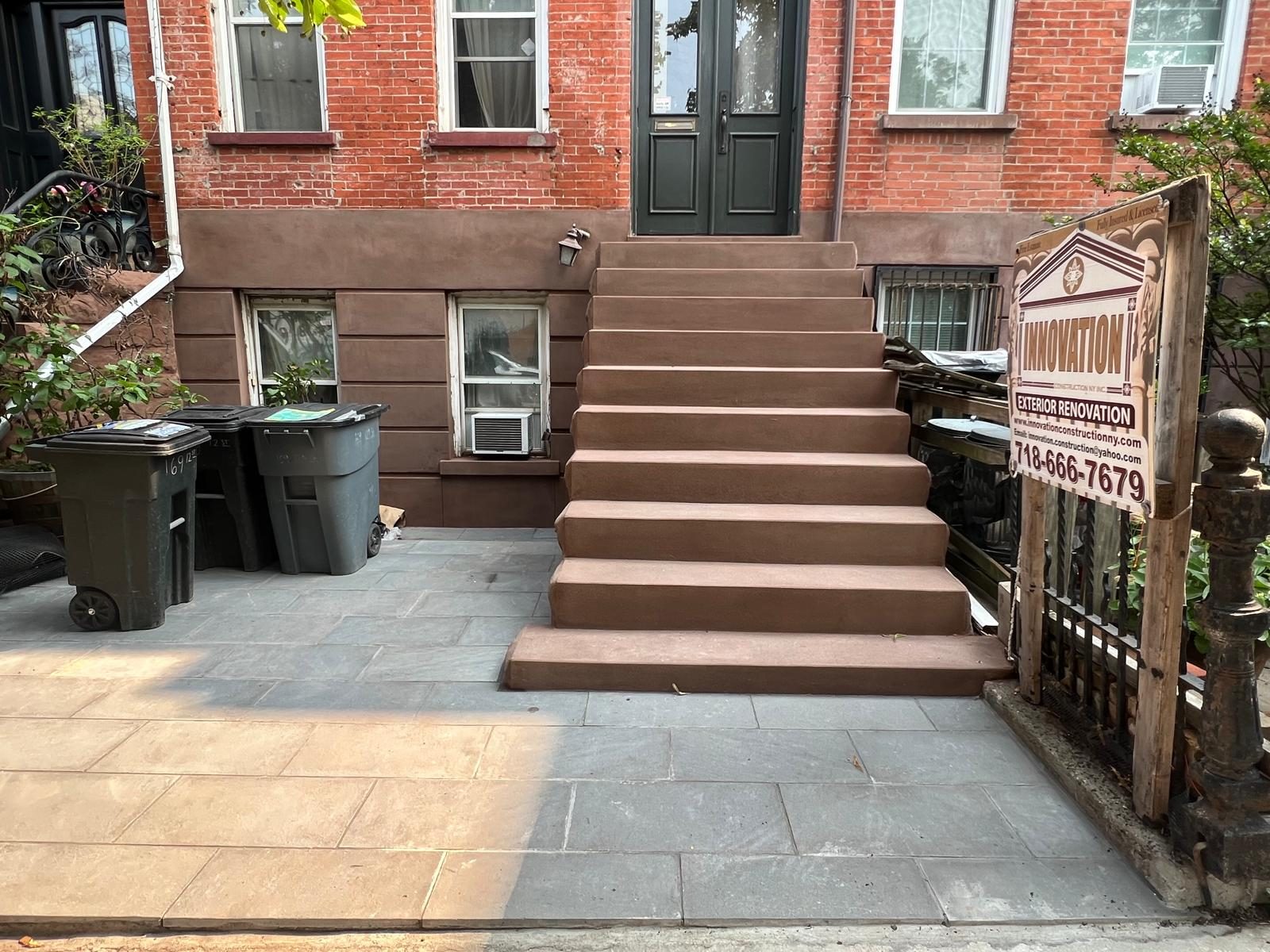 Innovation Construction NY active worksite with company signage at a Brooklyn brownstone restoration