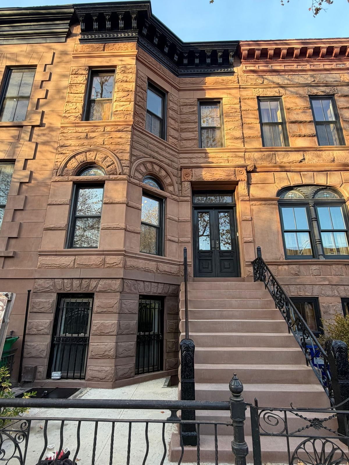 Romanesque Revival brownstone with rusticated stone façade in Bed-Stuy historic district