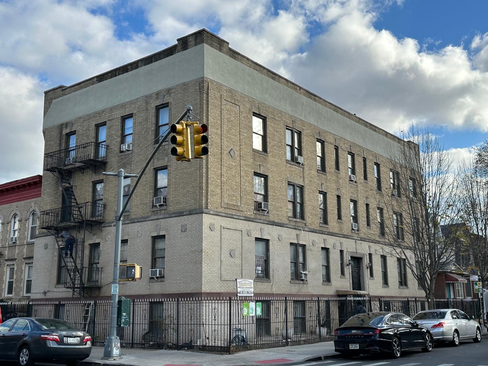 NYC DOT-compliant concrete sidewalk and bluestone restoration in front of a Brooklyn brownstone